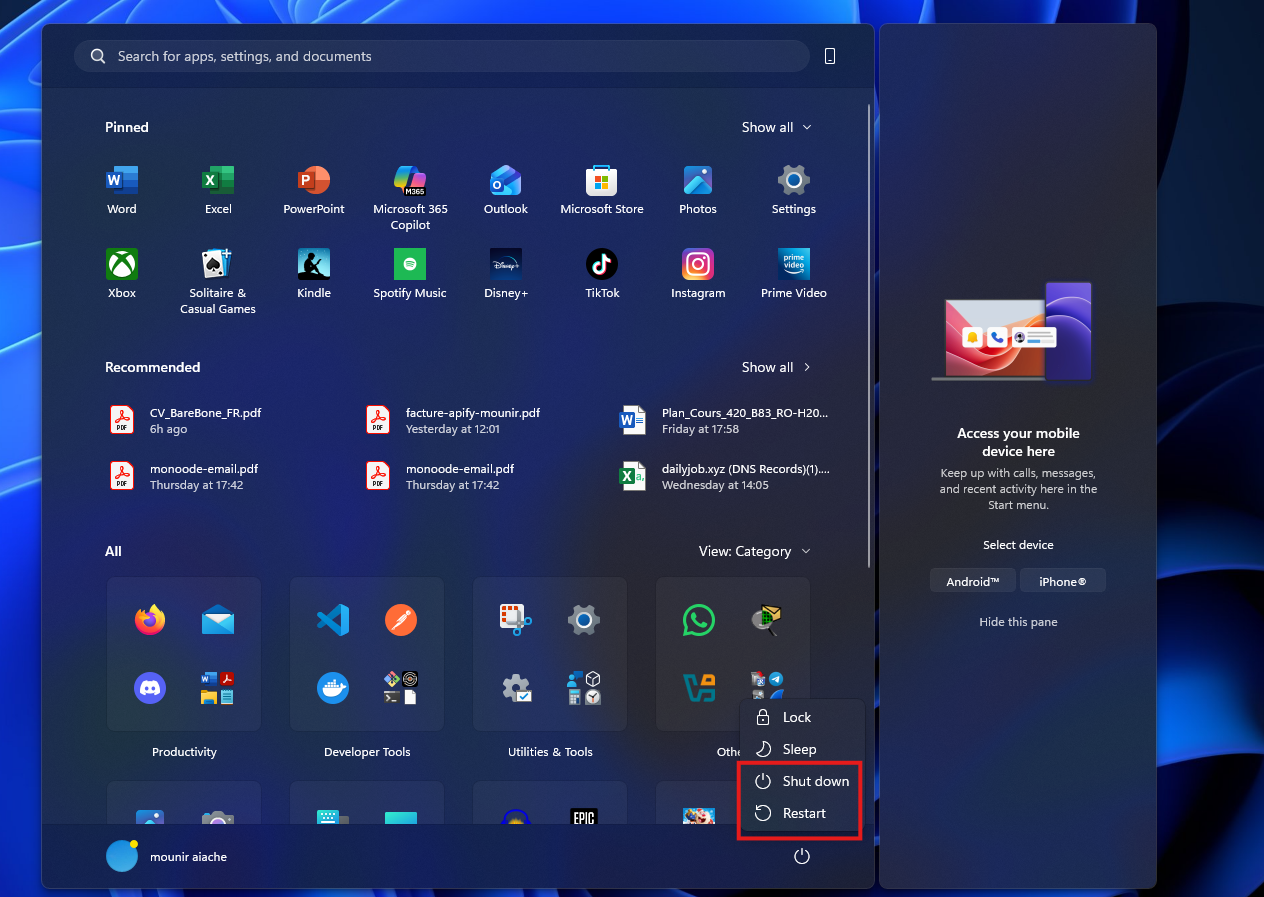 Menu Démarrer avec les options Arrêter et Redémarrer encadrées